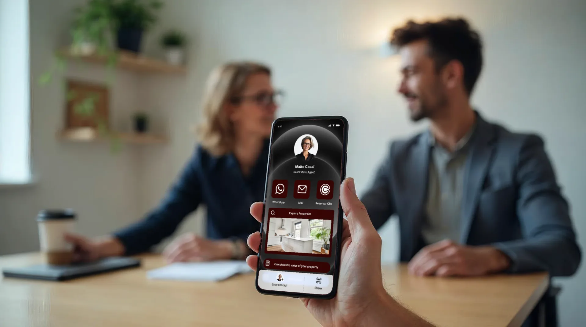 Close-up of a digital card on a phone during a client meeting